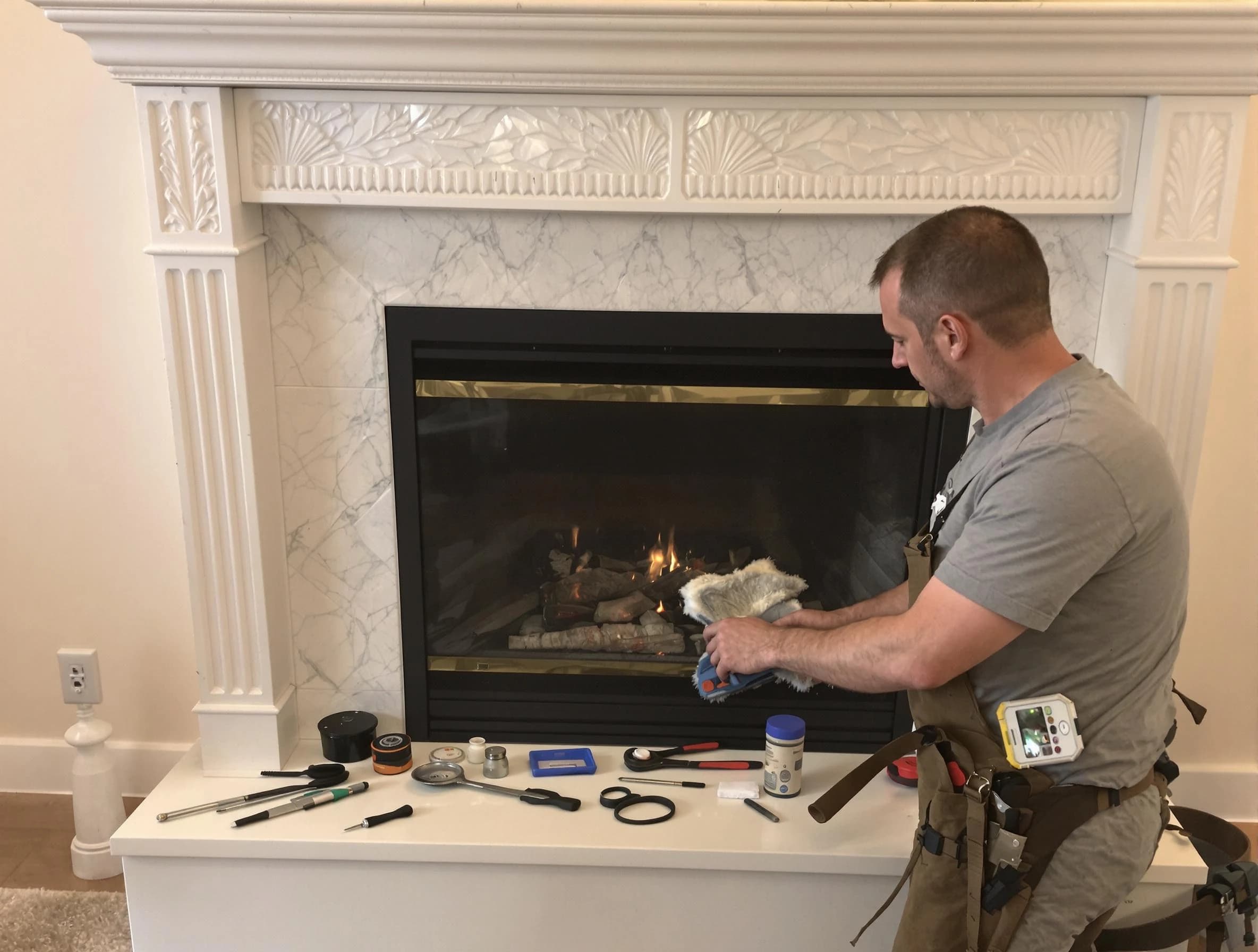West Point Chimney Sweep performing fireplace maintenance in West Point, UT