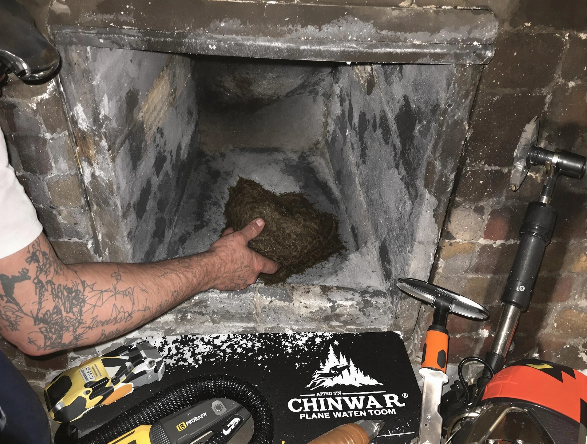 West Point Chimney Sweep safely removing debris and screening chimney in West Point, UT